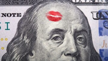 Imprint of the kiss on portrait of Benjamin Franklin on a hundred dollar bill.